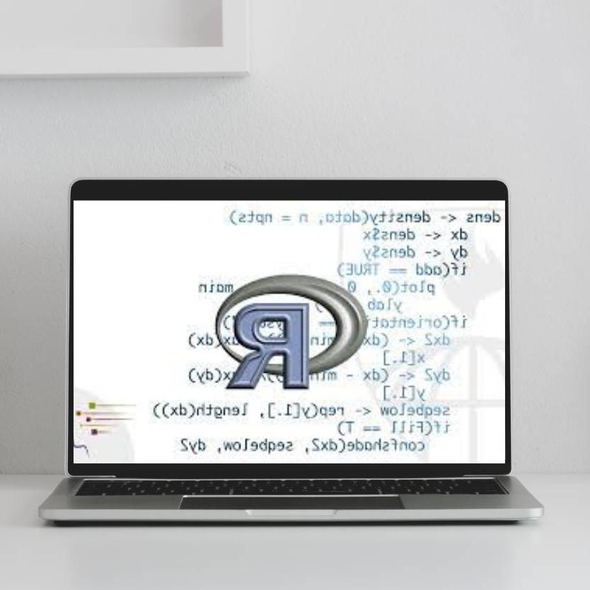 A laptop with a R and equations on the screen